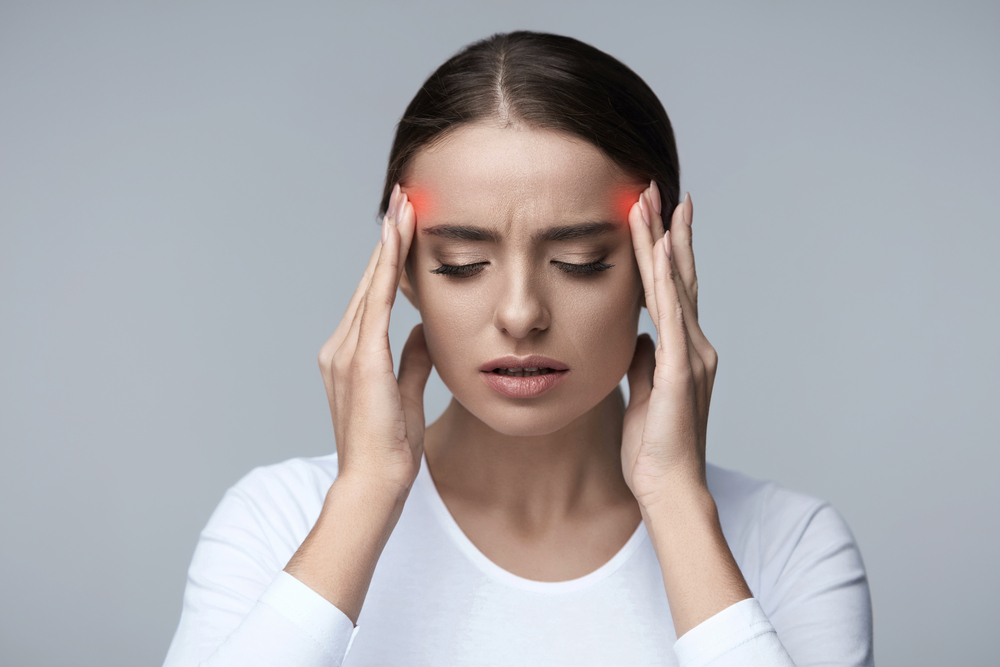 Image of a Beautiful Young Woman Feeling Strong Head Pain